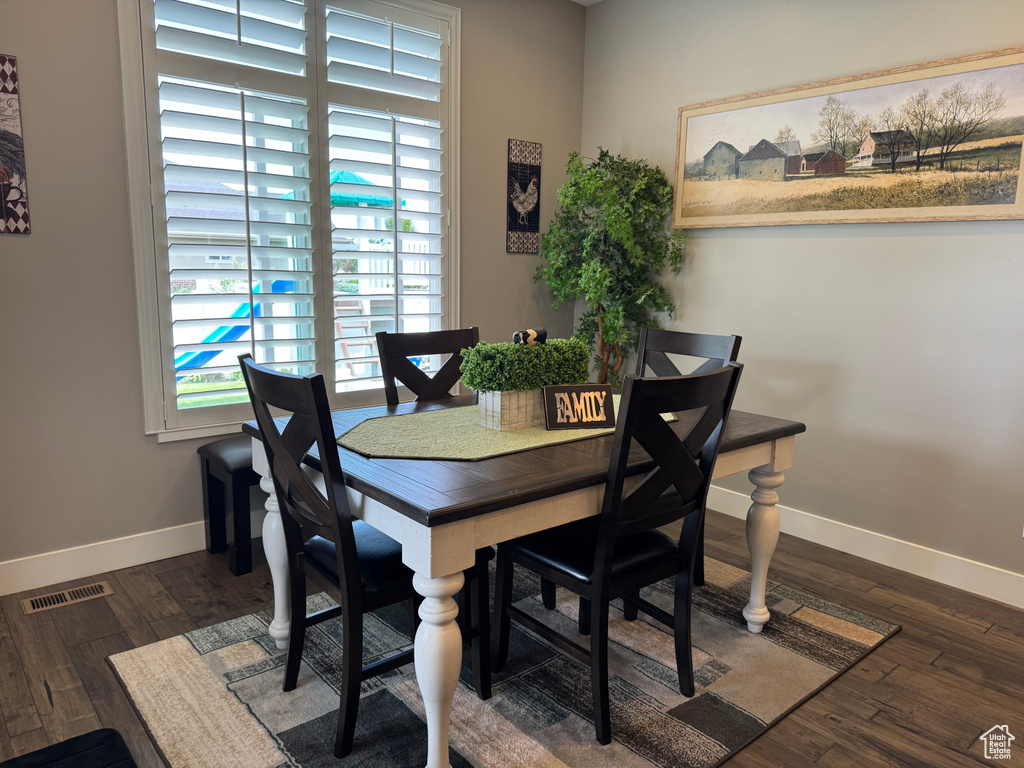 Dining room featuring baseboards and wood finished floors