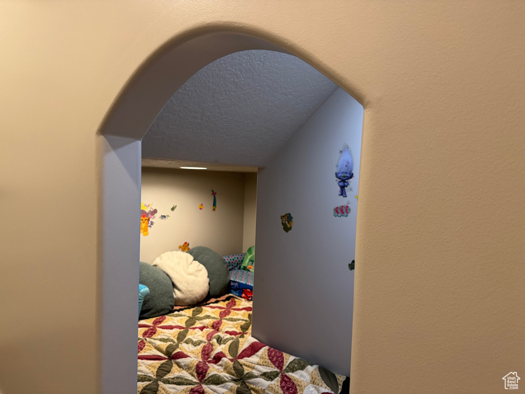 Bedroom with a textured ceiling