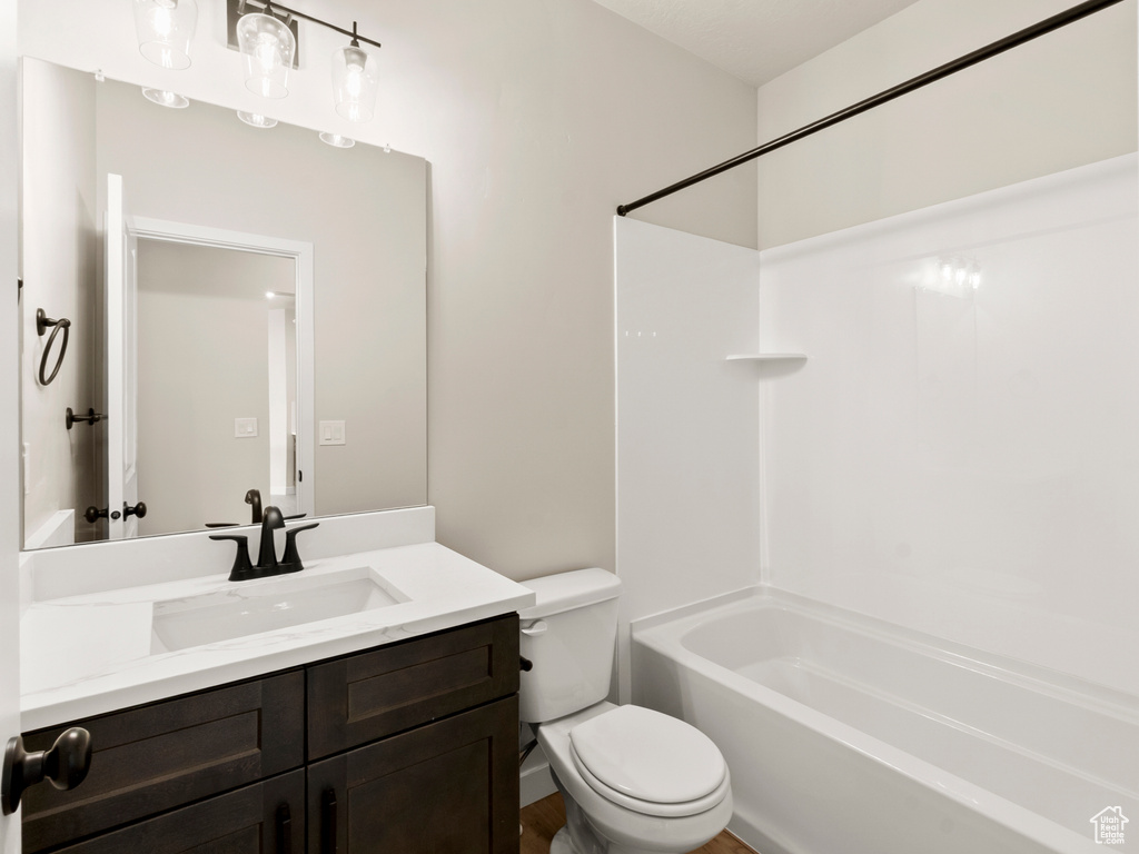 Bathroom with vanity and tub / shower combination