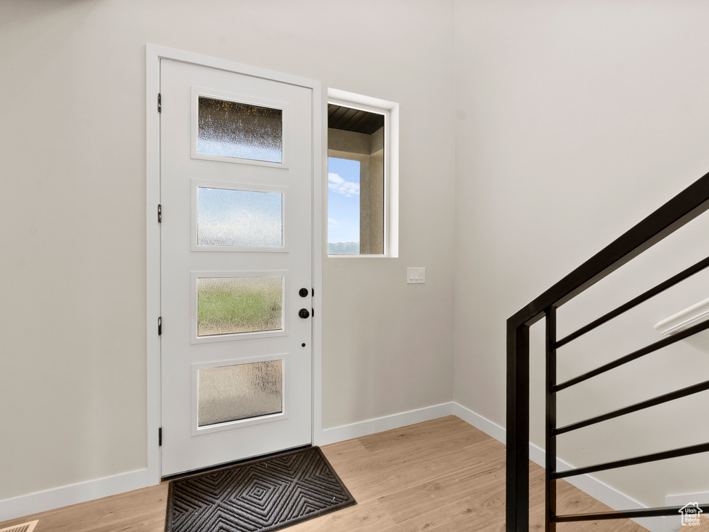 Entryway featuring light wood finished floors and baseboards