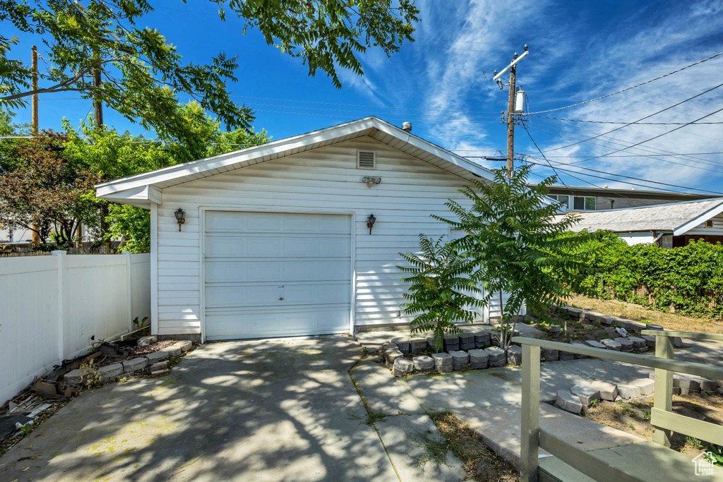 Detached garage with concrete driveway