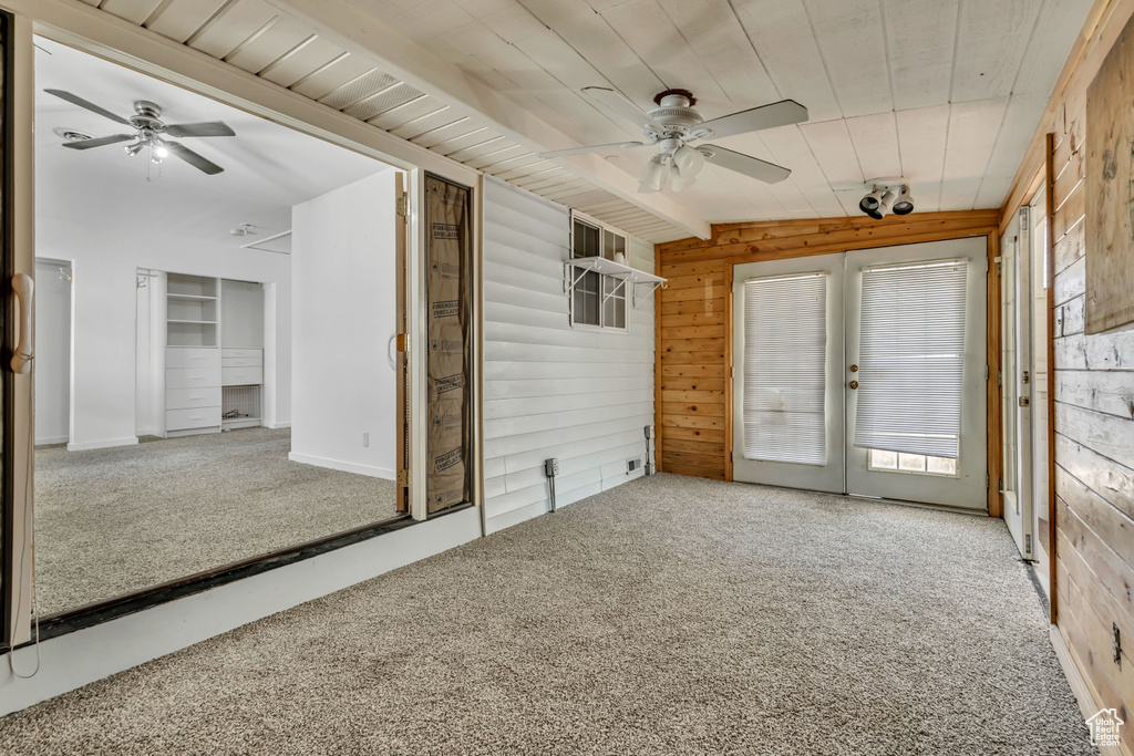 Unfurnished sunroom with french doors