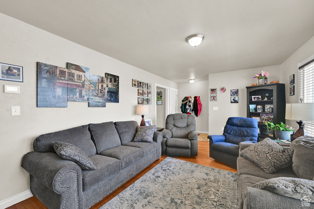 Living area featuring wood finished floors and baseboards