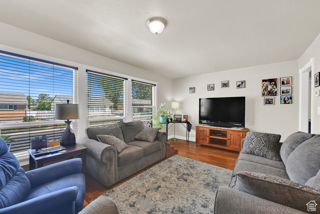 Living room featuring wood finished floors and baseboards