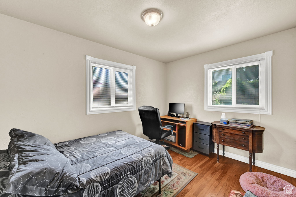 Bedroom with light wood-style floors