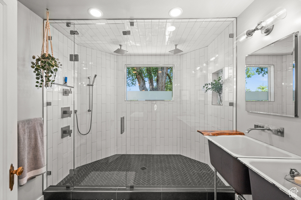 Bathroom featuring a stall shower and vanity