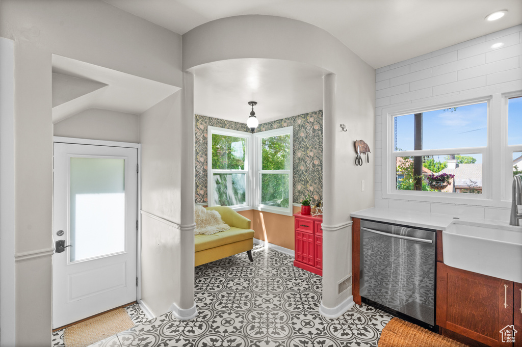 Entryway with healthy amount of natural light and baseboards