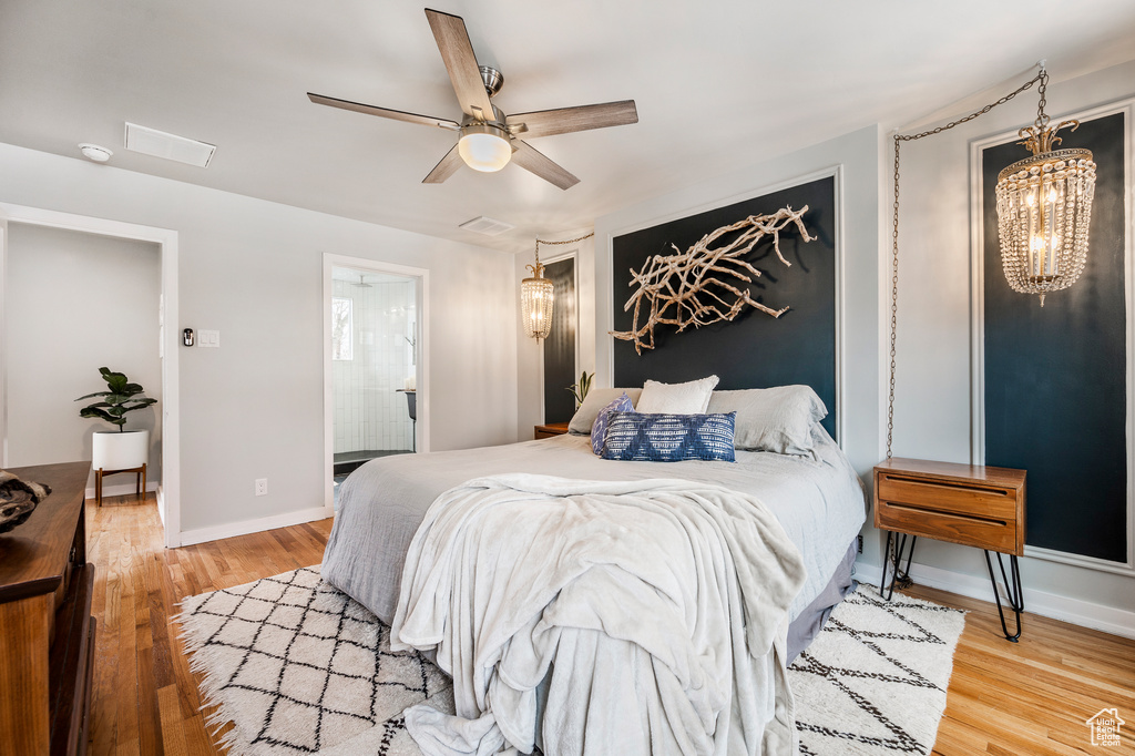 Bedroom with light wood-style flooring, baseboards, and ceiling fan