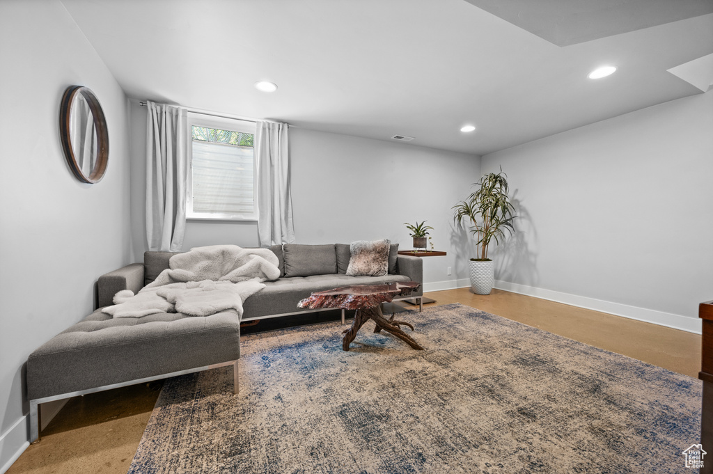Living room with recessed lighting and baseboards
