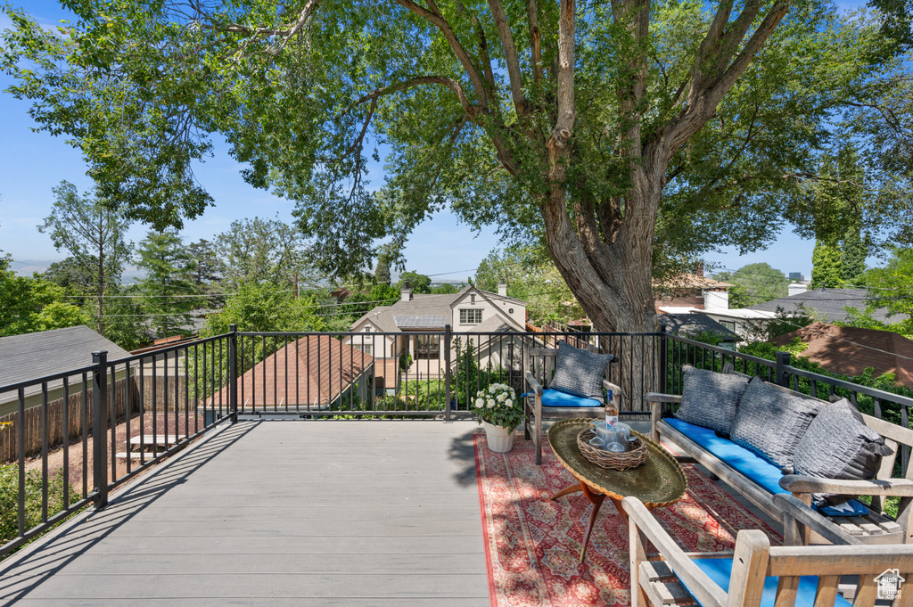 Wooden terrace featuring an outdoor living space