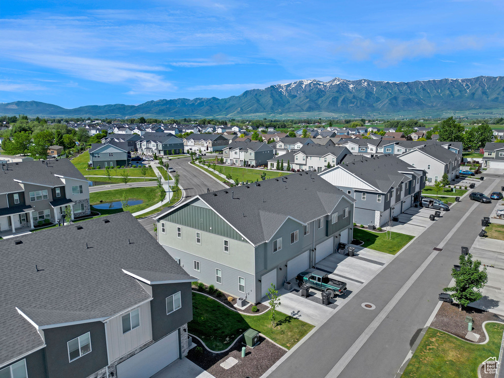 Aerial perspective of suburban area featuring a mountainous background