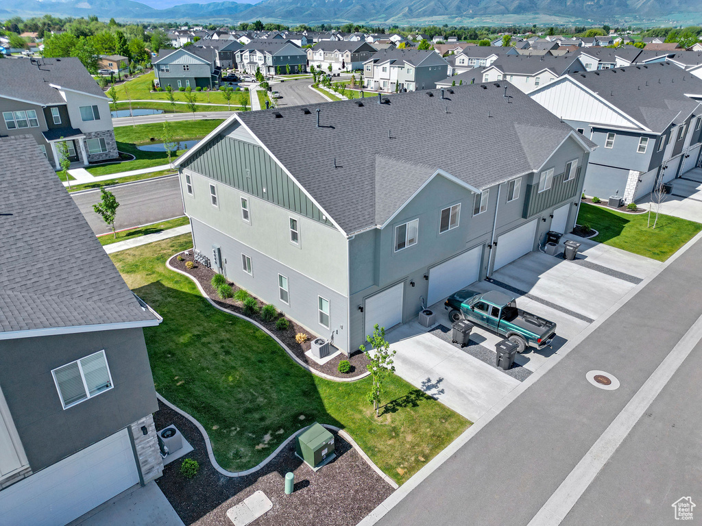 Aerial view of residential area featuring a mountain backdrop