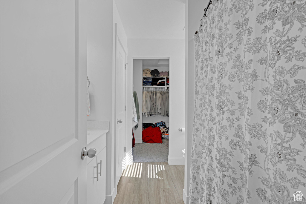 Hallway featuring light wood-type flooring