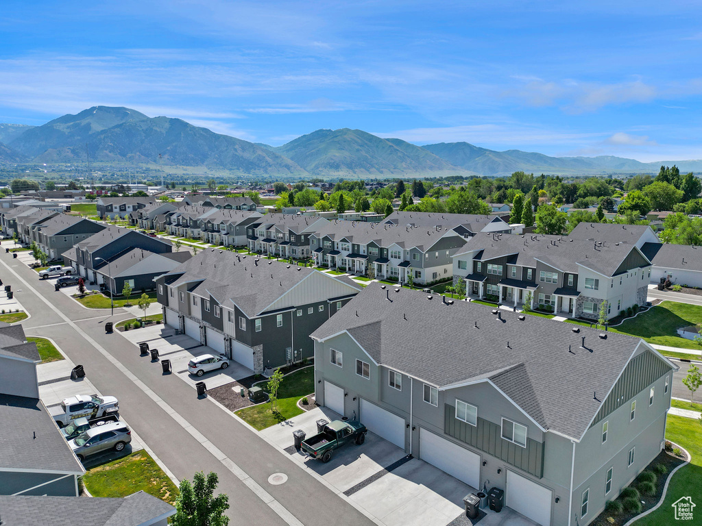 Aerial view of residential area featuring a mountainous background
