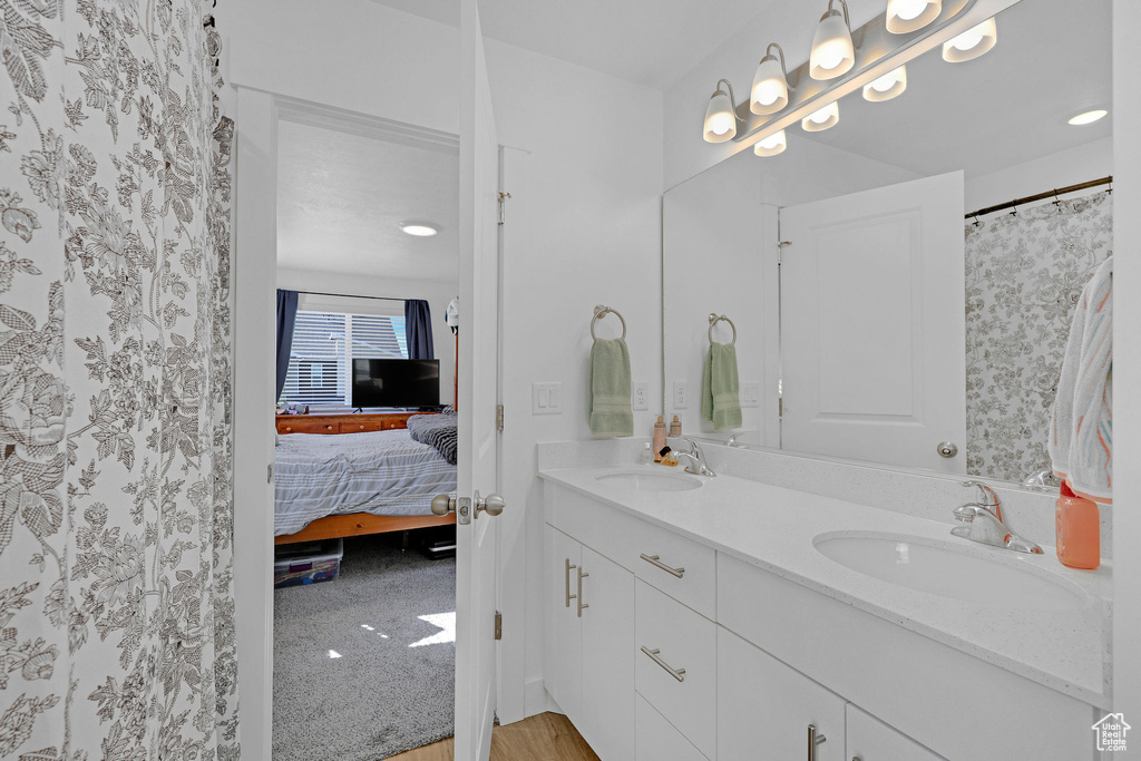 Ensuite bathroom featuring double vanity