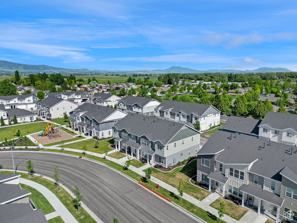 Aerial perspective of suburban area with a mountainous background