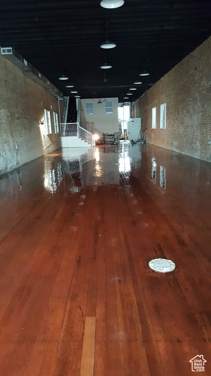 Hall with hardwood / wood-style flooring