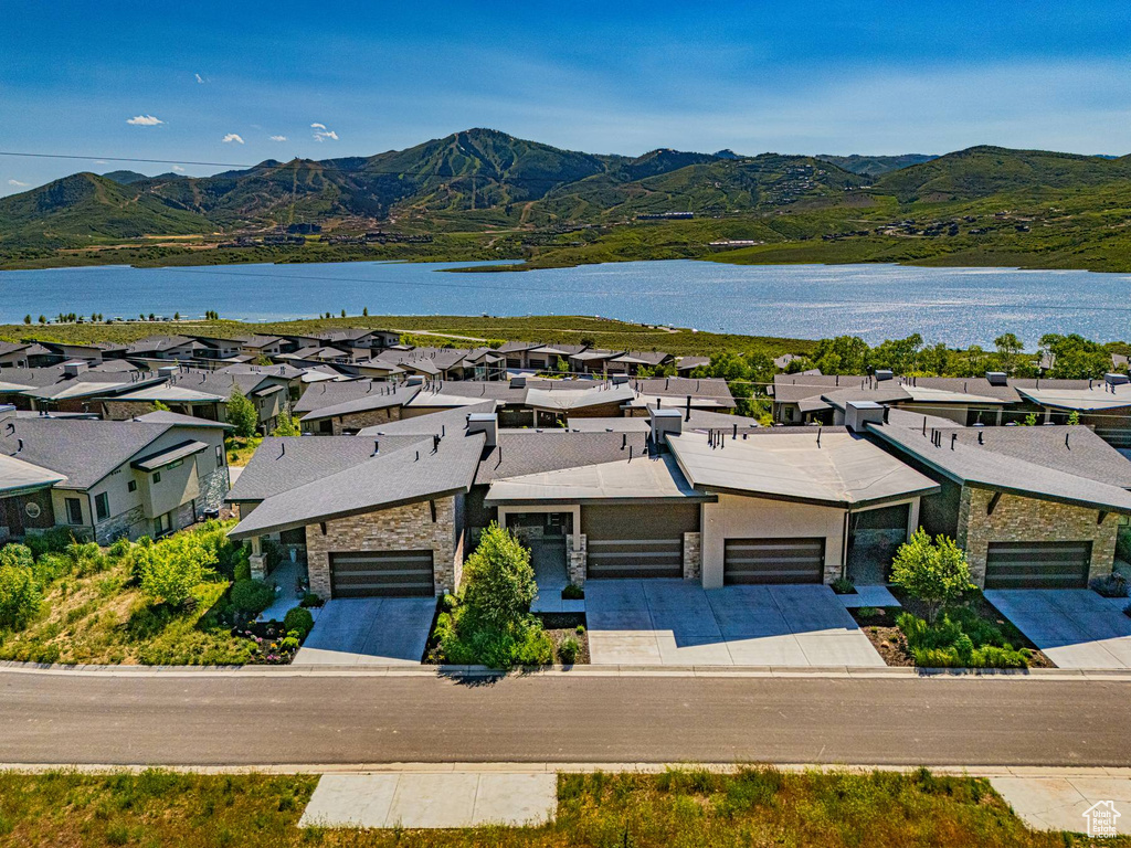 Aerial view of residential area featuring a water and mountain view