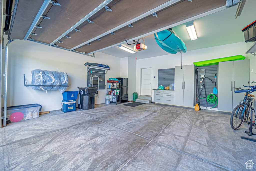 Garage featuring a garage door opener