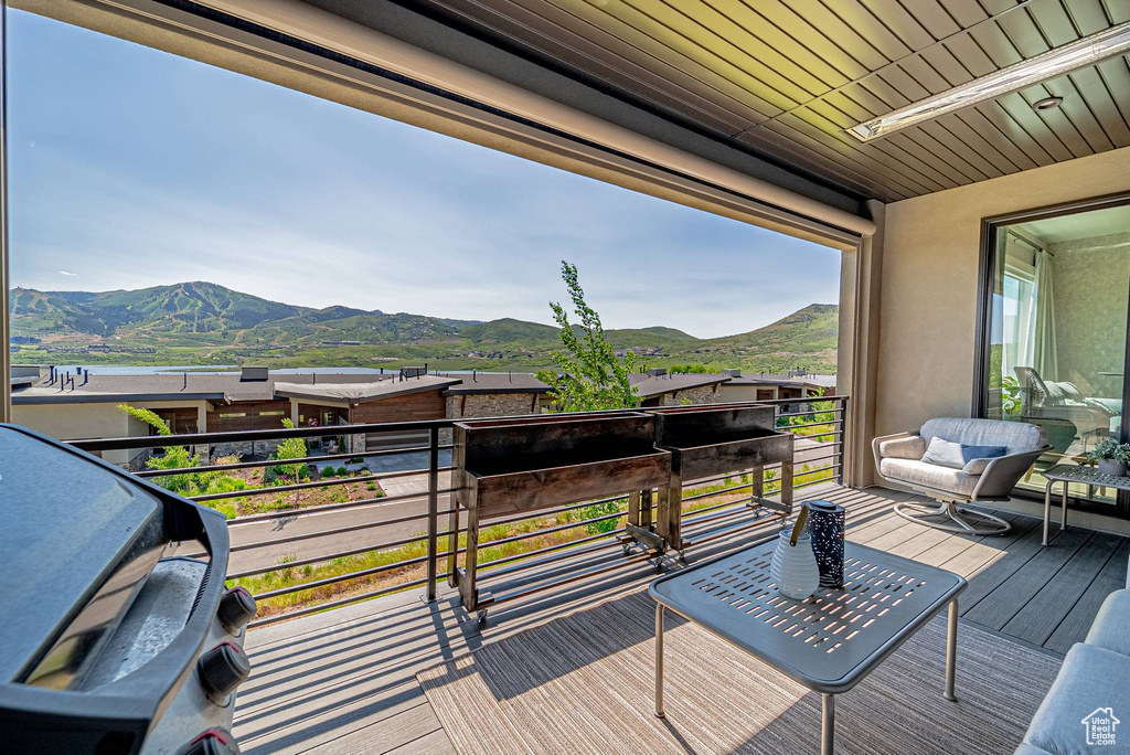 Wooden terrace featuring a mountain view