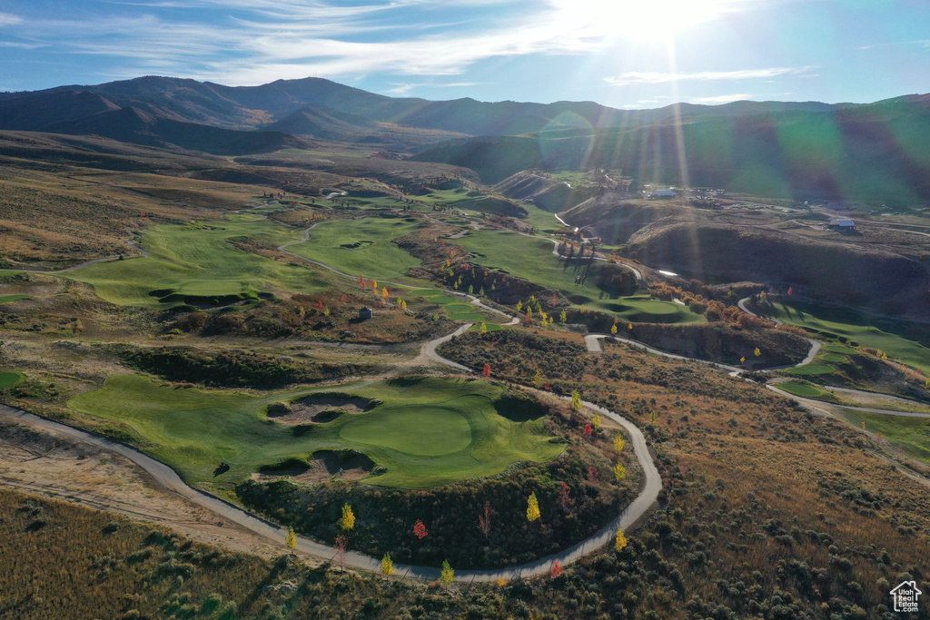 View of property location featuring mountains and a golf club