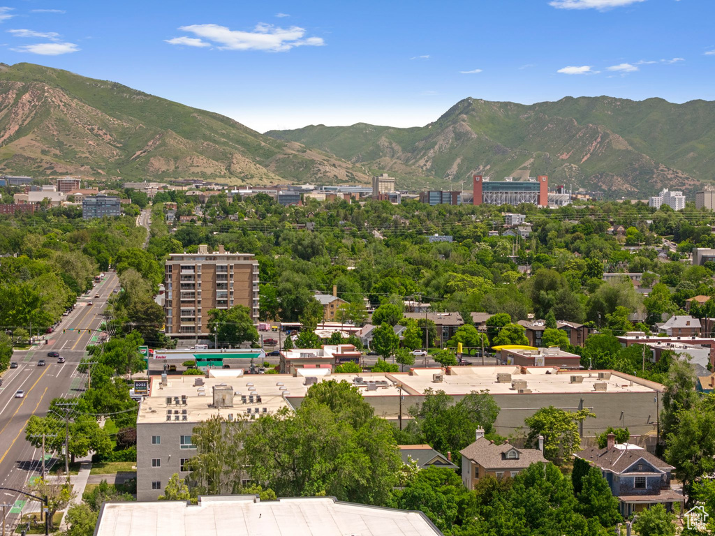 View of mountain backdrop featuring nearby urban area