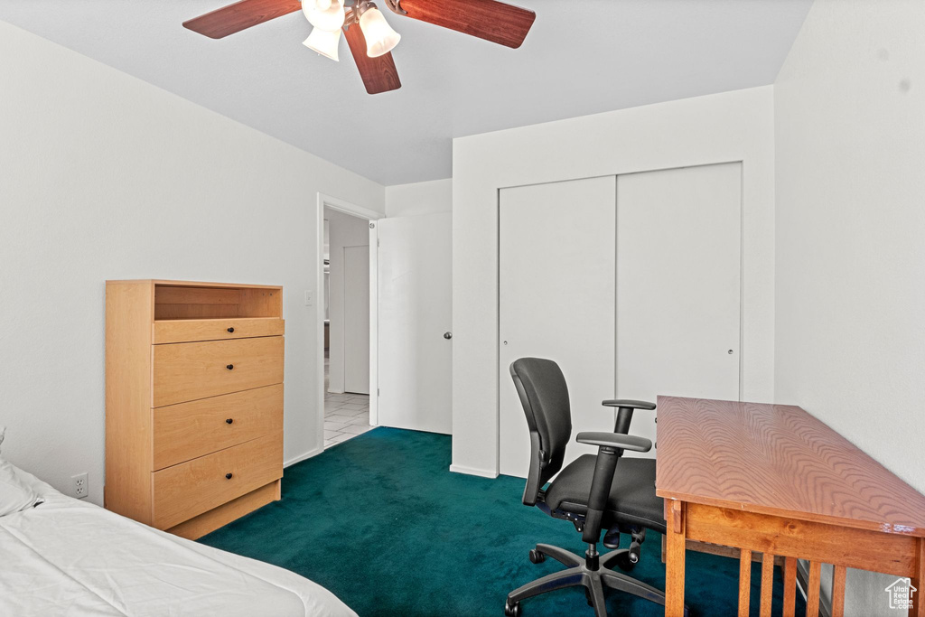 Bedroom featuring carpet flooring, a closet, ceiling fan, and an office area