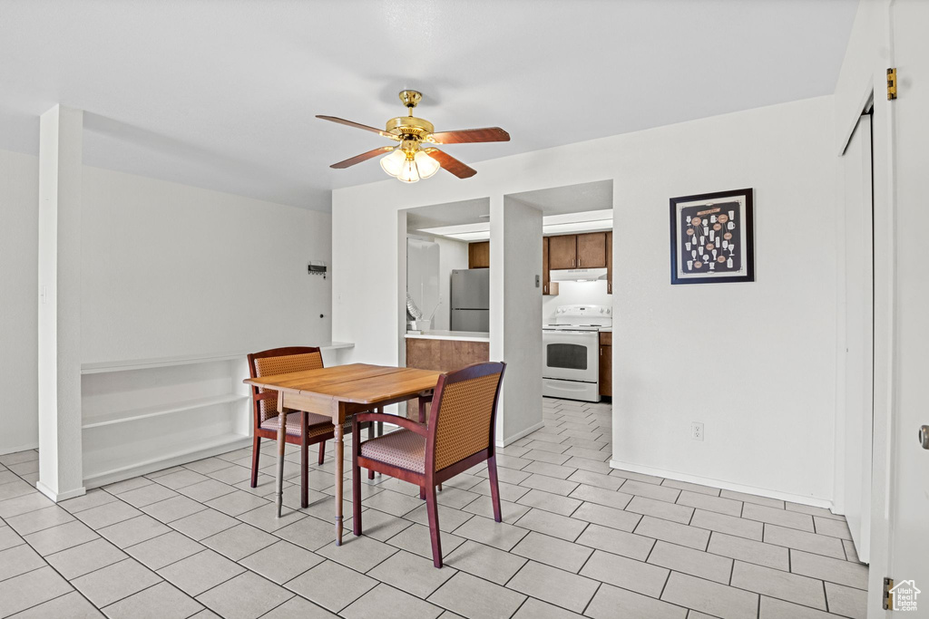 Dining space featuring a ceiling fan