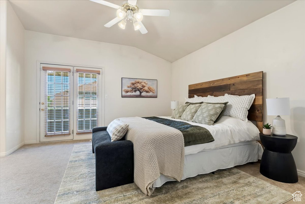 Bedroom featuring carpet flooring, access to outside, baseboards, vaulted ceiling, and a ceiling fan