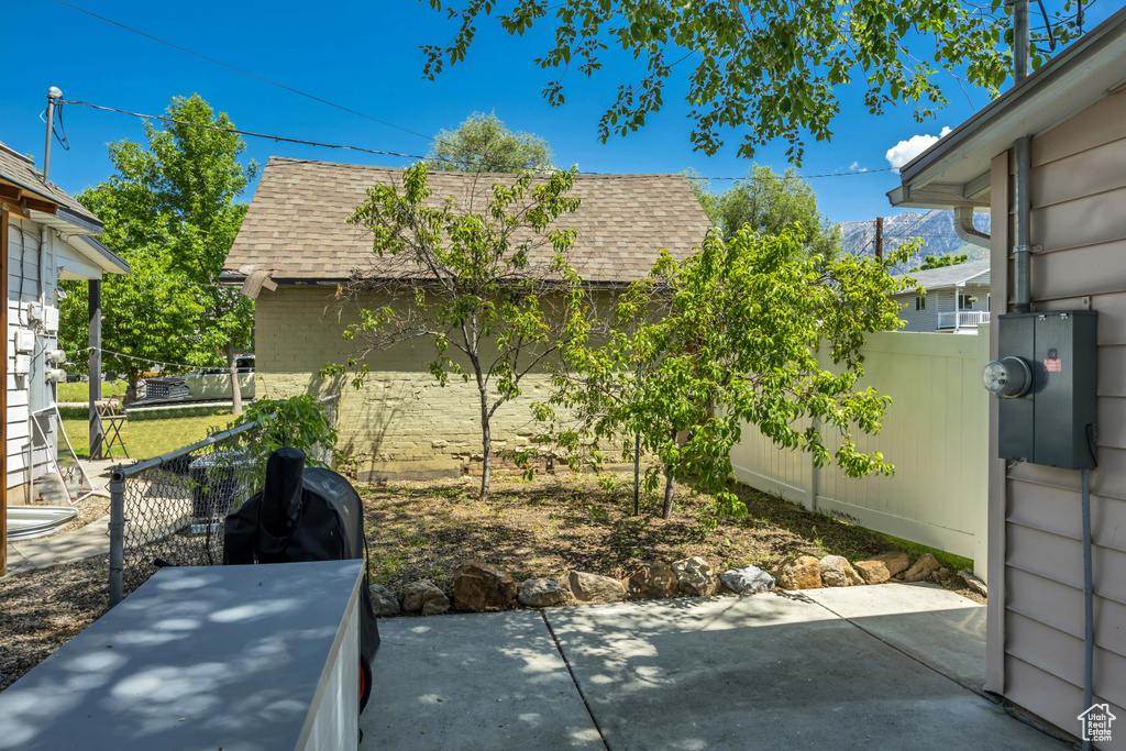 Fenced backyard with a patio area