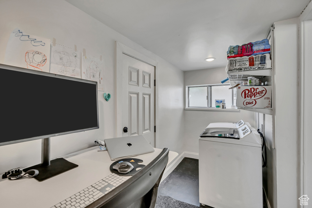 Washroom with an office area, baseboards, and washer and dryer