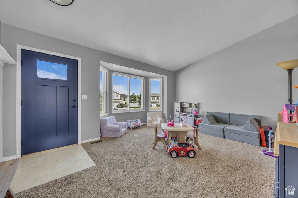 Recreation room featuring carpet and baseboards