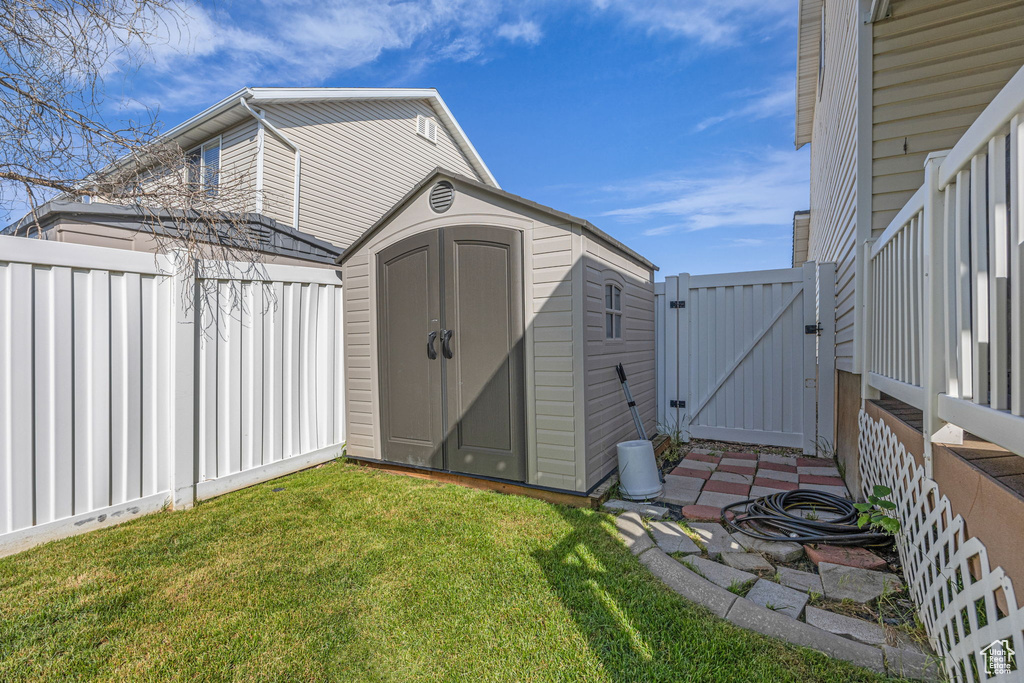View of shed featuring a gate