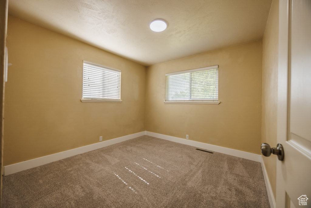 Spare room with carpet flooring and baseboards
