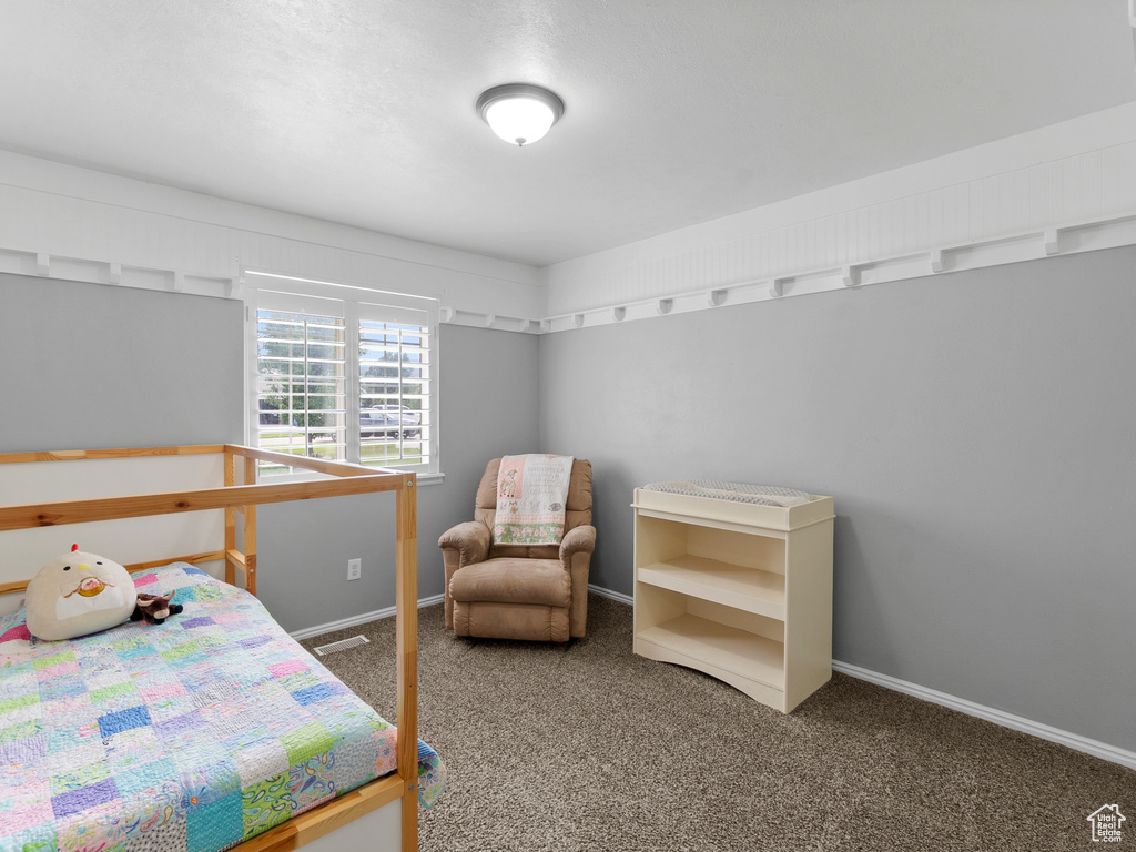 Carpeted bedroom with baseboards