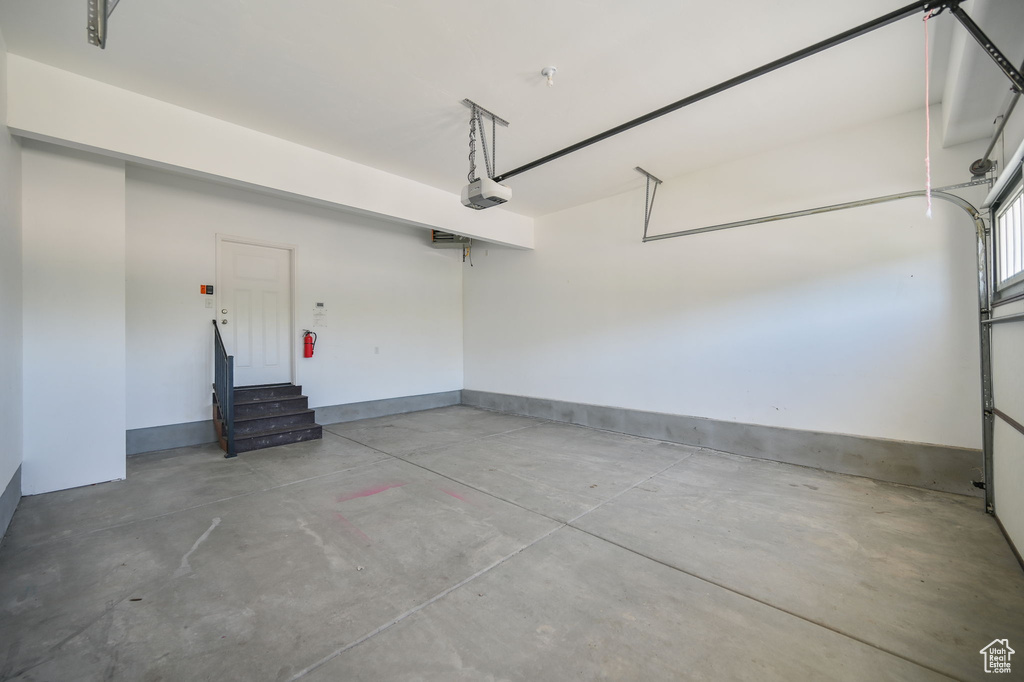 Garage featuring a garage door opener