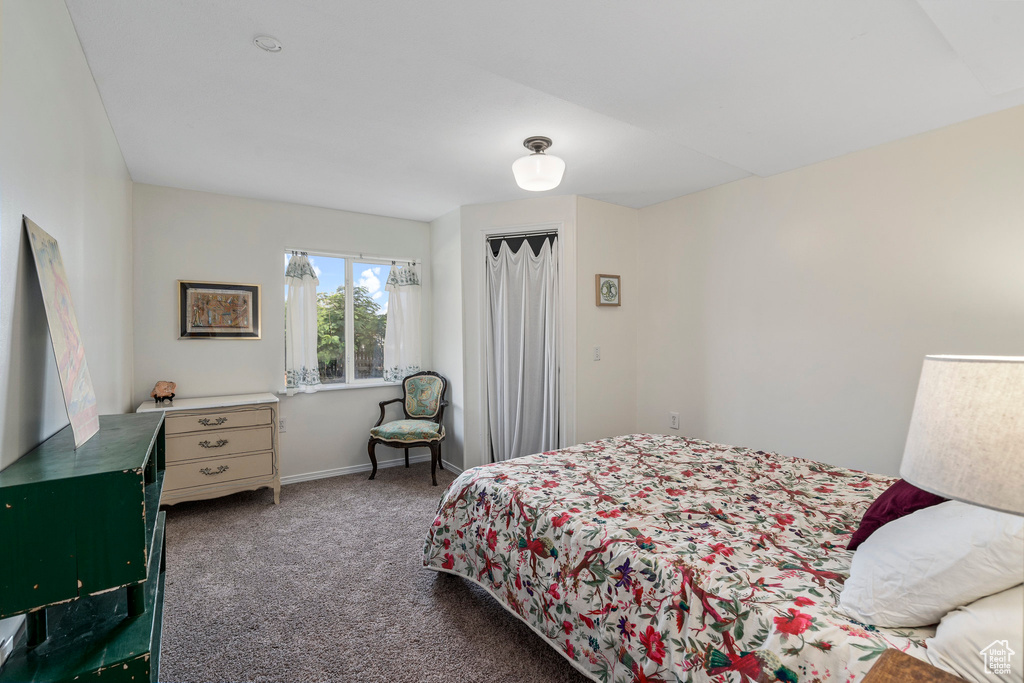 Carpeted bedroom with baseboards