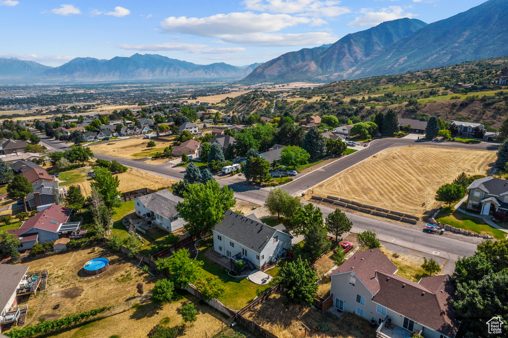 Aerial perspective of suburban area with a mountain backdrop