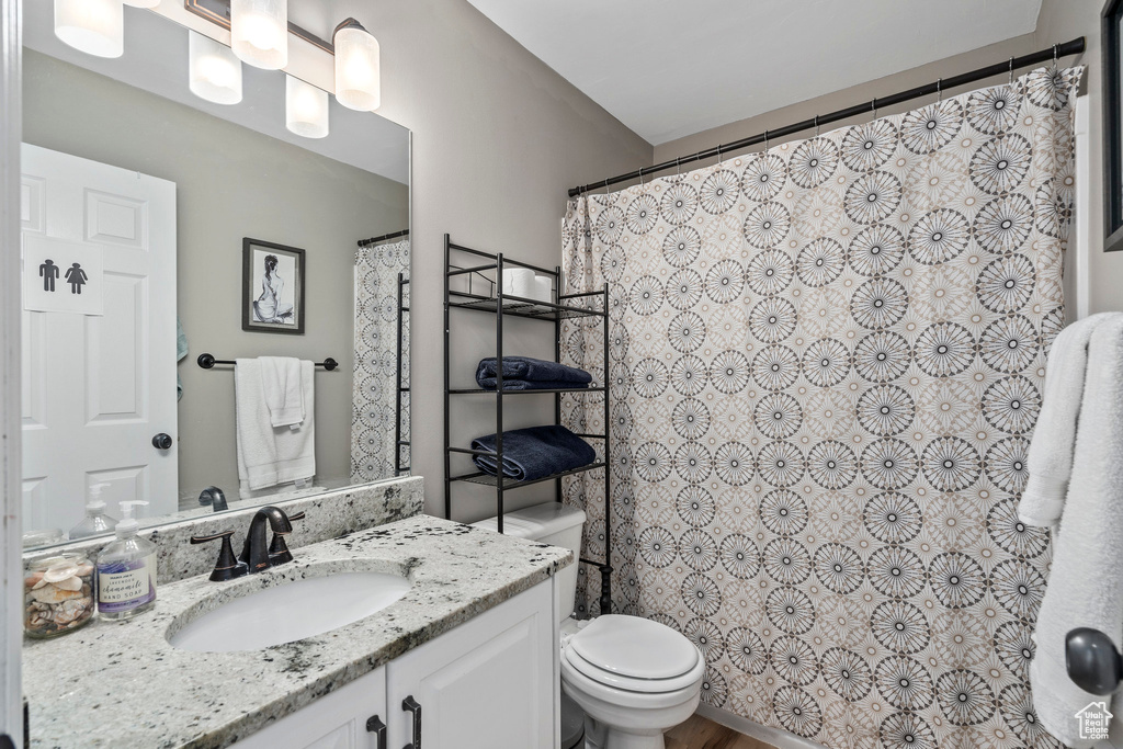 Full bath with vanity and toilet
