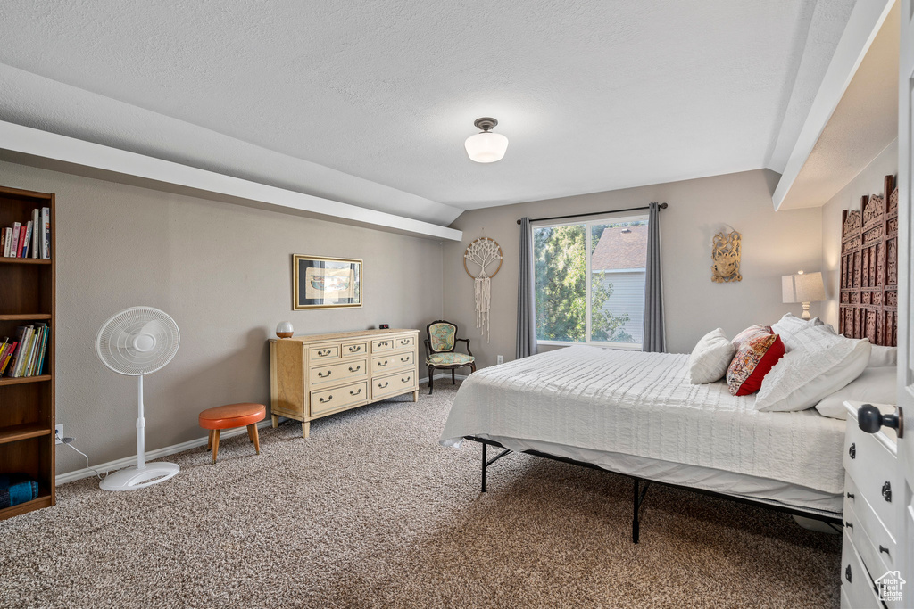 Bedroom with carpet flooring and baseboards