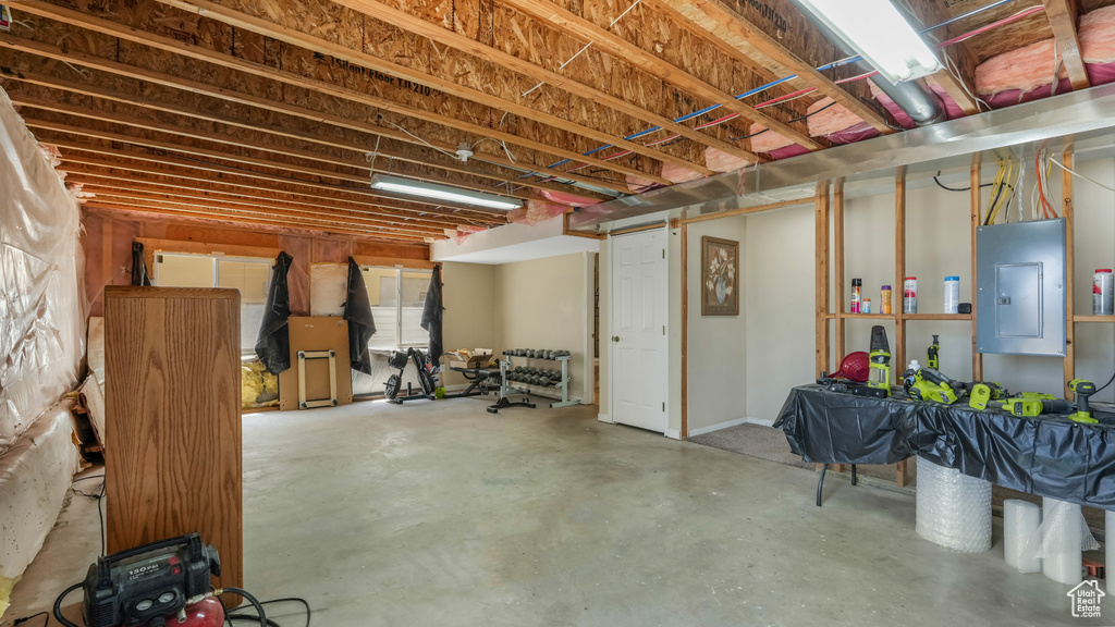 Unfinished below grade area featuring electric panel