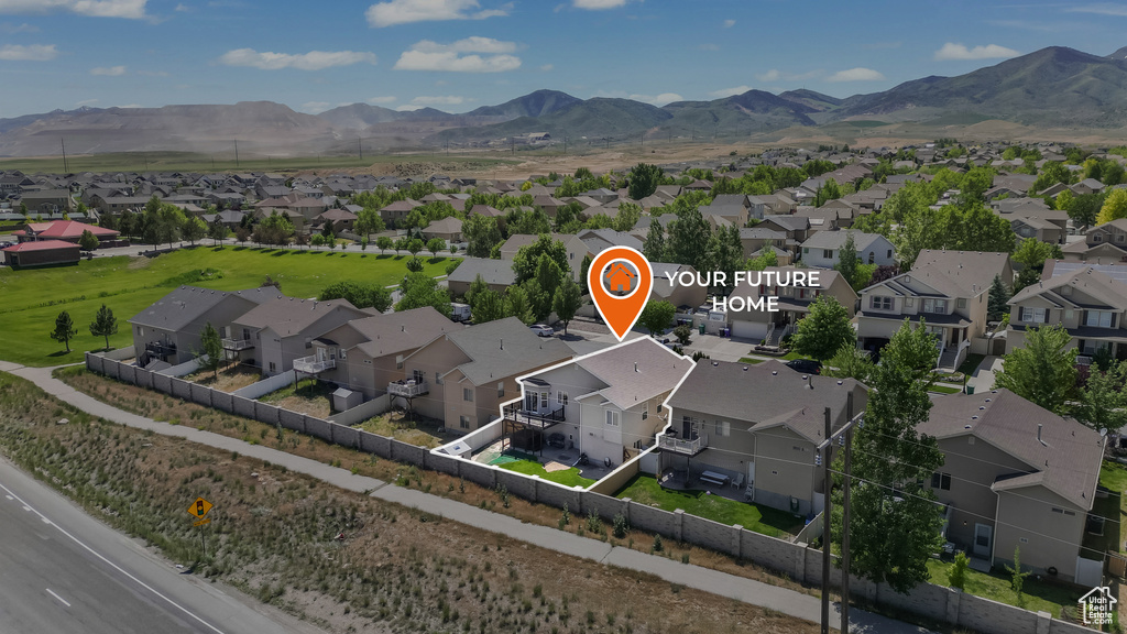Aerial view of residential area with a mountainous background
