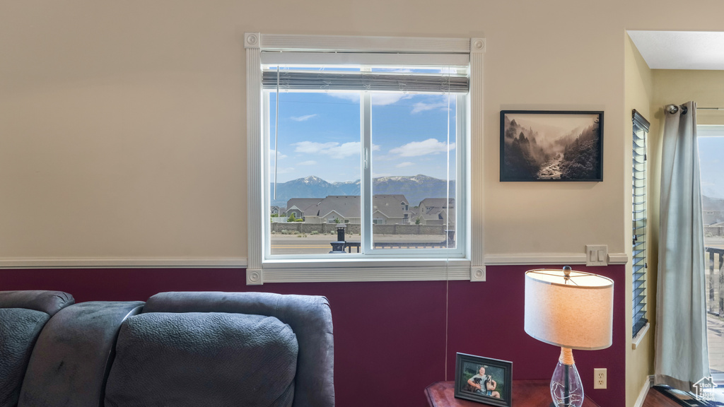 Living area featuring healthy amount of natural light and a mountain view