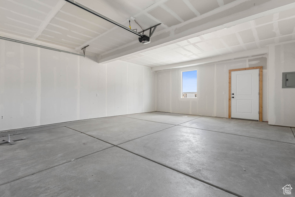 Garage with a garage door opener and electric panel