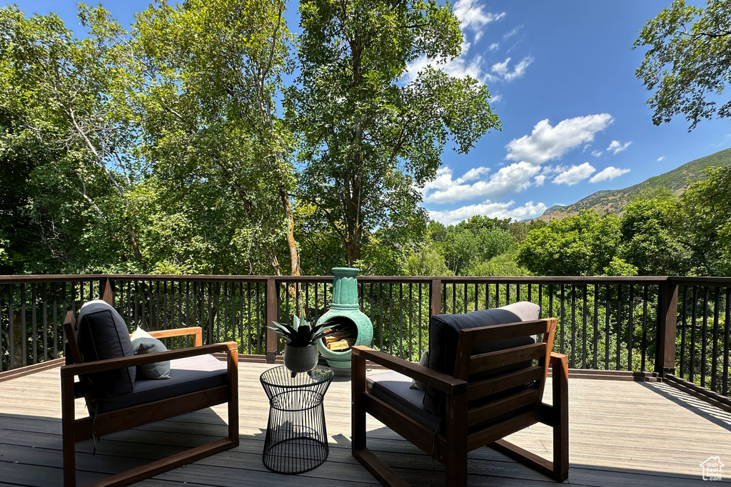 Wooden terrace featuring a mountain view
