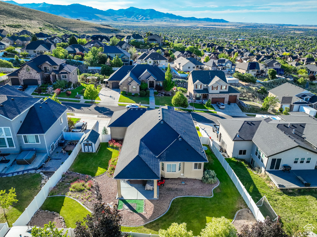Aerial perspective of suburban area featuring a mountain backdrop