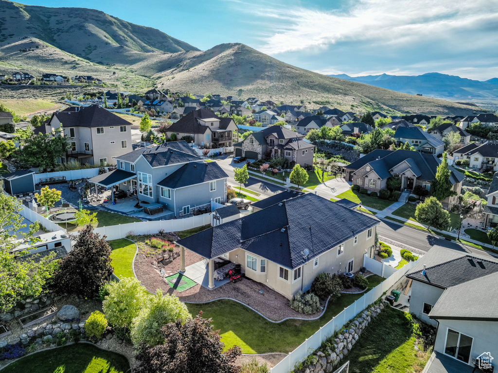 Aerial perspective of suburban area with a mountain backdrop