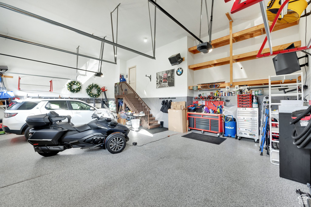 Garage featuring a garage door opener