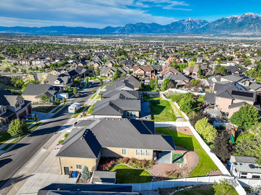 Aerial perspective of suburban area featuring a mountain backdrop