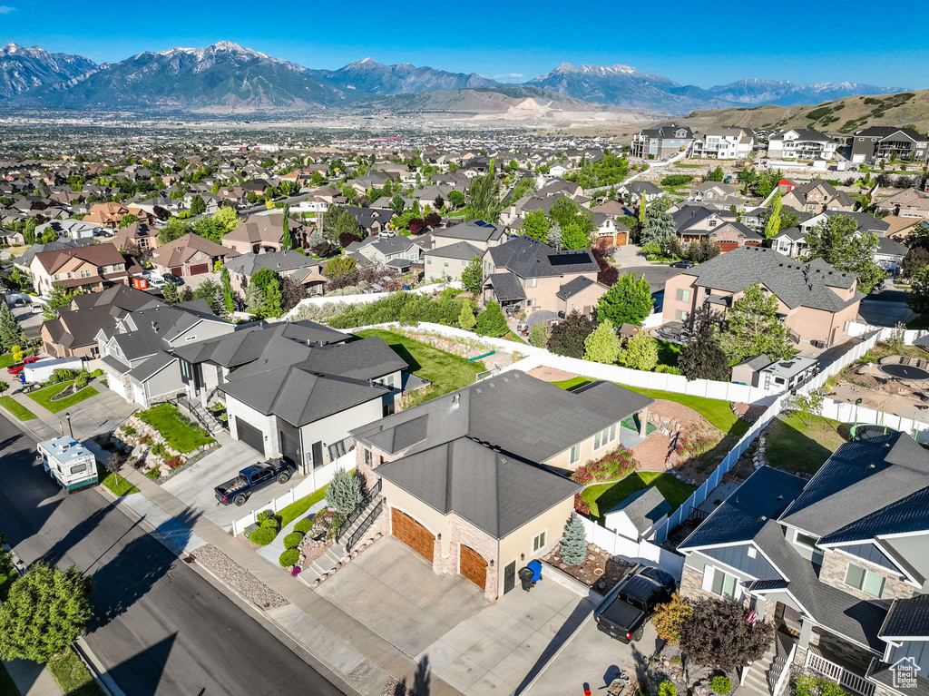 Aerial perspective of suburban area featuring a mountain backdrop